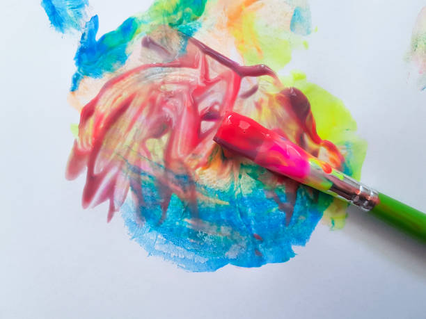 istock brush with bright paints on a white background 904490750