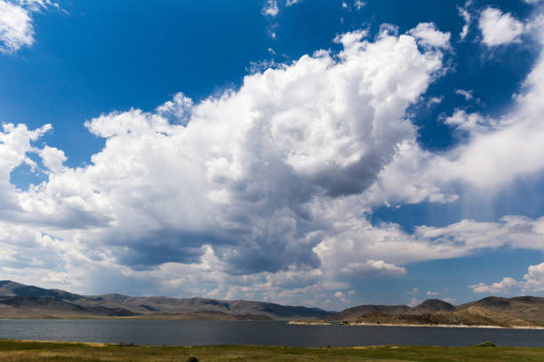 istock Cumulus Clouds and Blue Sky Over Lake 904494380