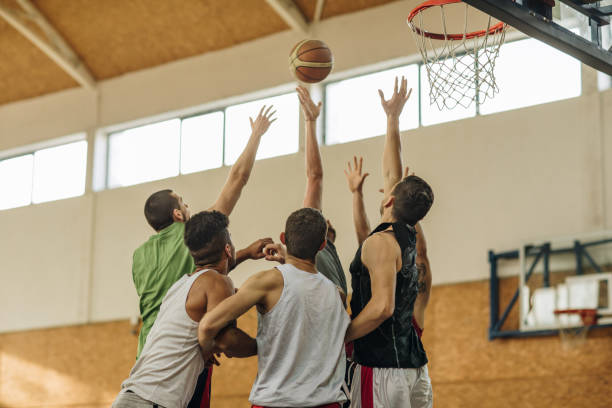 istock Large group of young athletic men playing basketball. 904495482