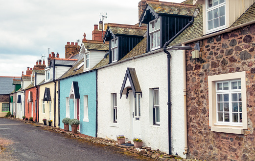 A row of old fashioned terraced cottages in East Lothian, Scotland.