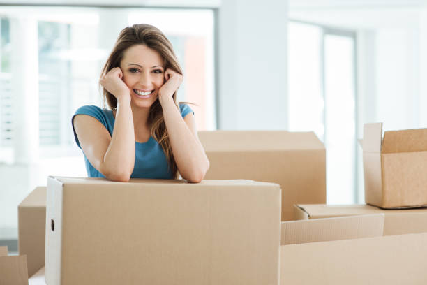 istock Woman moving in her new house 904506000