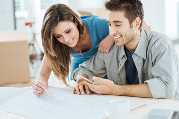 istock Couple designing their new house 904506578