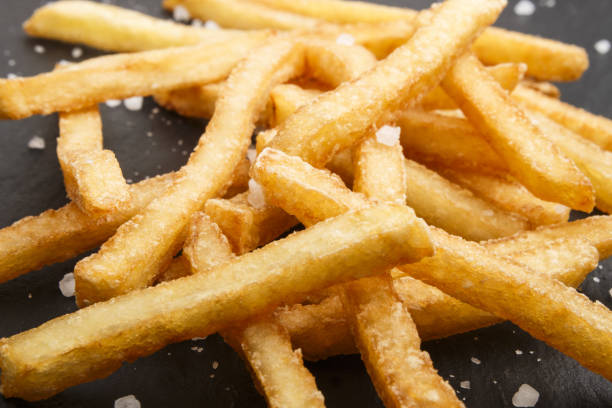 istock french fries with coarse salt on slate 904510498