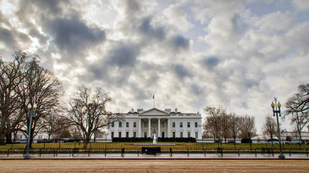 1600 PA Ave The White House at 1600 Pennsylvania Avenue, probably America"u2019s most famous address. white house exterior stock pictures, royalty-free photos & images