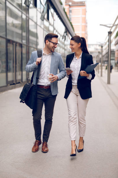istock Two business people on their way to work 904516250