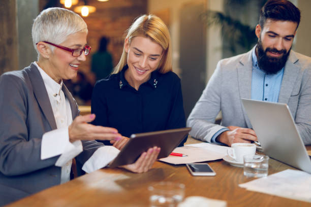 istock Businesswomen discussing business during meeting while using digital tablet 904518676