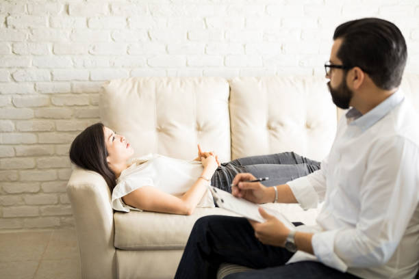 istock Hispanic woman sharing her problems with psychologist 904523936