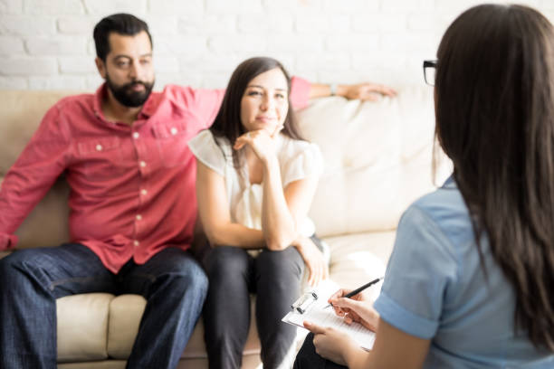 istock Psychologist taking notes during couple counseling session 904526808