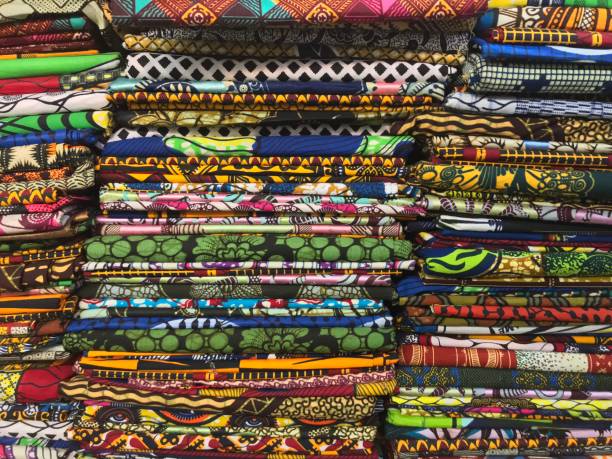 istock Stack of colorful cloth selling in the market 904527504
