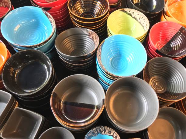 istock Stack of colorful ceramic bowl in the market 904527594