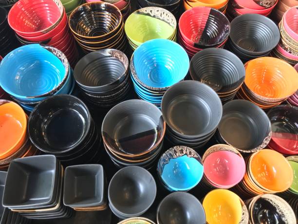 istock Stack of colorful ceramic bowl in the market 904527654