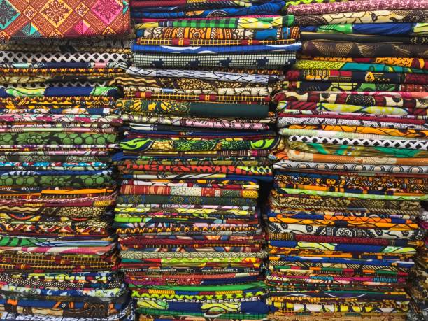 istock Stack of colorful cloth selling in the market 904527678