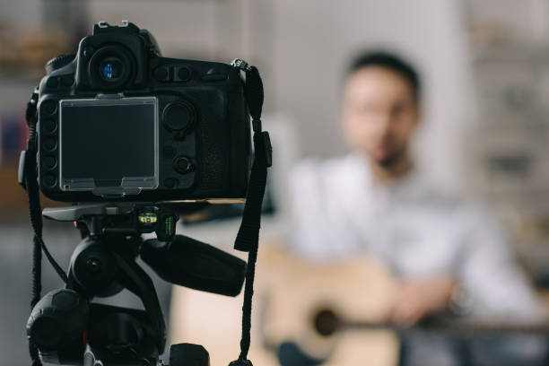 istock digital camera and music blogger on blurred background 904531584