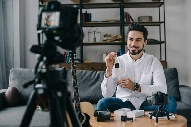 istock smiling technology blogger recording new vlog about smart watch 904532460