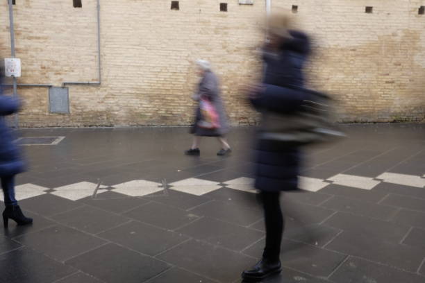 istock blurry people walking in the city center 904532778
