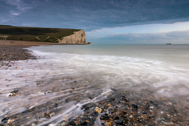 istock Sea and pebbles in Cuckmere Haven with the Seven Sisters cliffs 904534870