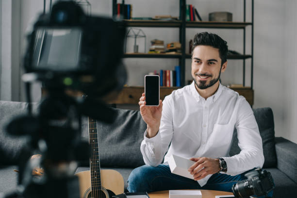 istock smiling technology blogger recording new vlog about smartphone 904534972