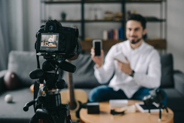 istock technology blogger pointing on new smartphone with camera on foreground 904535030
