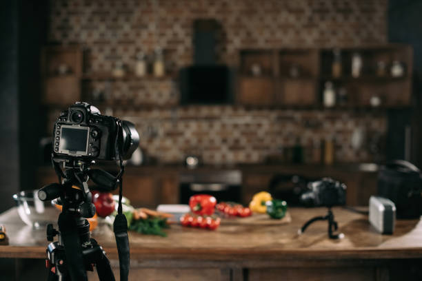 istock cameras and vegetables on table for food blog 904543400