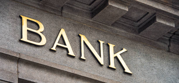 istock Bank sign on traditional stone 904543874