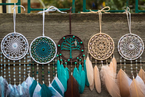 istock Handmade dream catcher with feathers threads and beads rope hanging 904545174