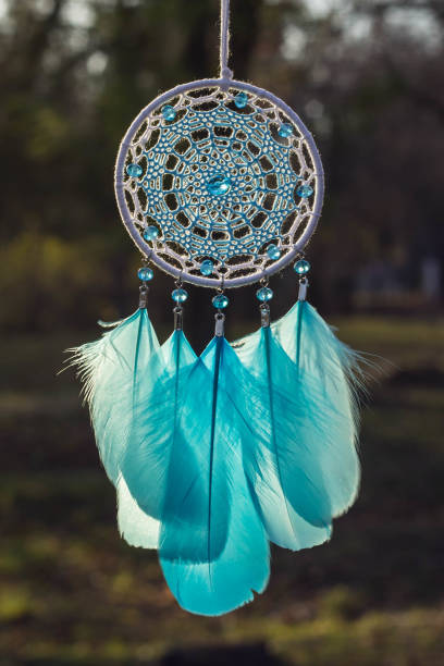 istock Handmade dream catcher with feathers threads and beads rope hanging 904545206