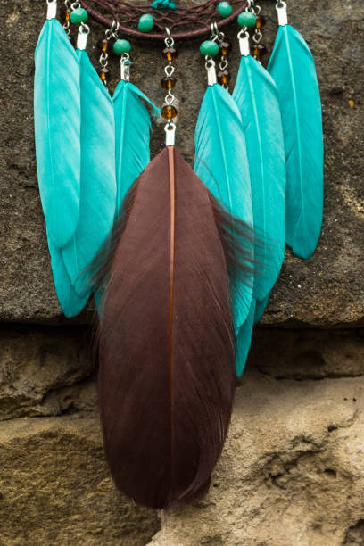 istock Handmade dream catcher with feathers threads and beads rope hanging 904547606