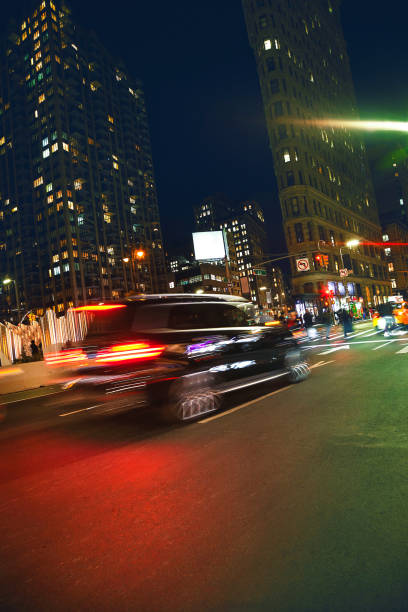 istock Manhattan motion blurred car at flatiron building 904555204