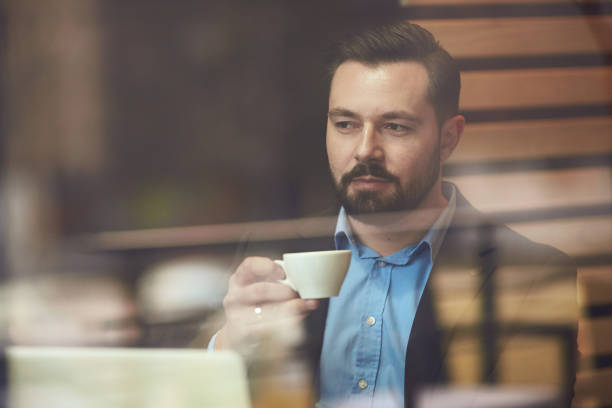 istock Businessman sitting in cafe. 904557904