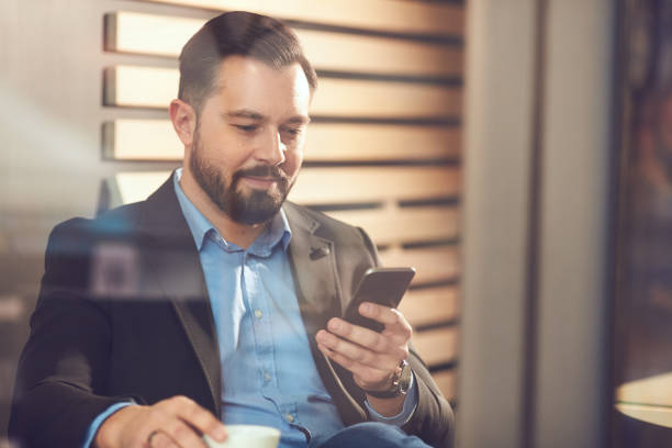 istock Businessman sitting in cafe. 904557930