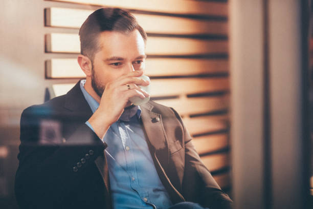 istock Businessman sitting in cafe. 904557944