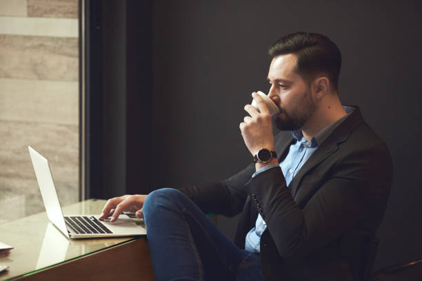 istock Businessman sitting in cafe. 904557968
