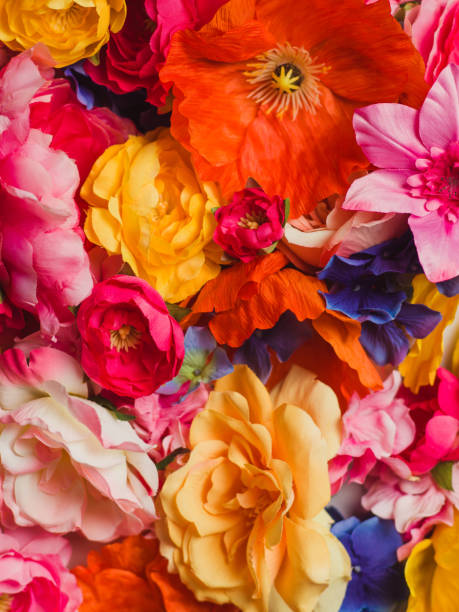 istock Flower Immersion still life background of textile flowers 904559140