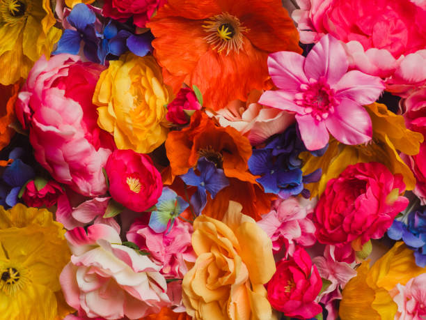 istock Flower Immersion still life background of textile flowers 904560184