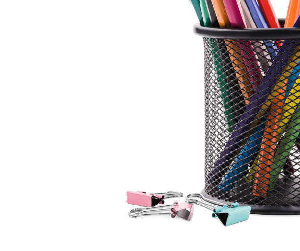 istock Color pencils in a cup, clips for papers. Isolated on white background. 904564978