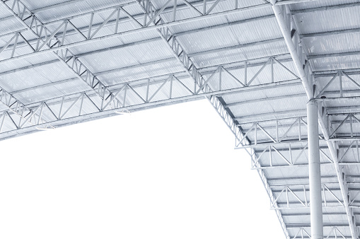 Large steel structure truss, roof frame and metal sheet in building construction site