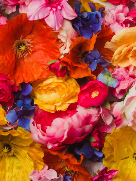 istock Flower Immersion still life background of textile flowers 904569178