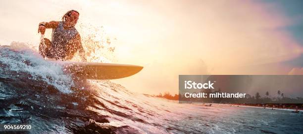 Surfer Rides The Ocean Wave Stock Photo - Download Image Now - Surfing, Wave - Water, Breaking Wave
