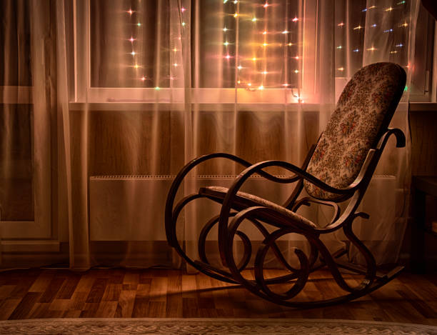 istock A rocking chair by the window 904569872