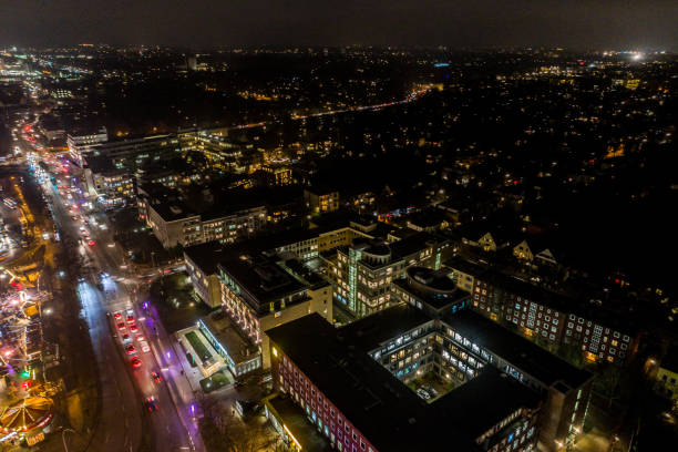 Aerial view of Hamburg at night, Germany. Christmas time. Wandsbek station. City traffic. Christmas decorations. Aerial footage. Night. stock photo