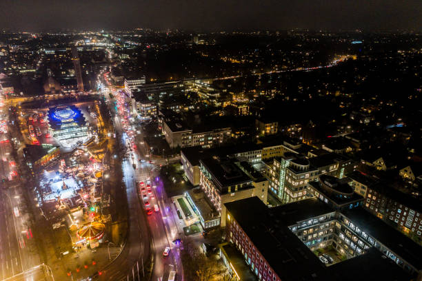 Aerial view of Hamburg at night, Germany. Christmas time. Wandsbek station. City traffic. Christmas decorations. Aerial footage. Night. stock photo
