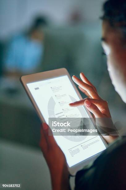 Checking Out Business Stats Stock Photo - Download Image Now - Digital Tablet, Data, Technology