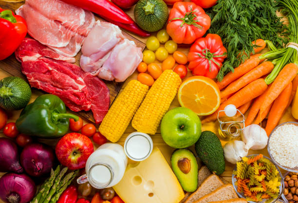Different types of food from the food pyramid seen from above. stock photo