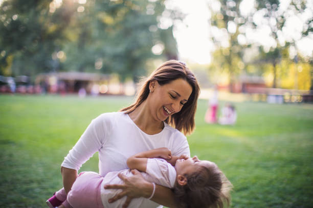 istock Mother and daughter in park 904590220