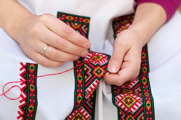 istock Female hand embroider at cross 904590246