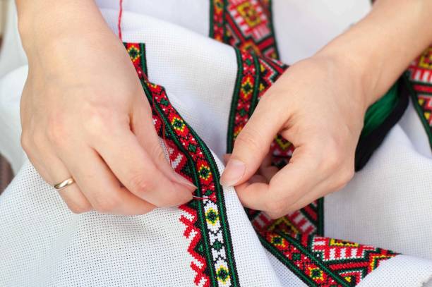 istock Female hand embroider at cross 904590252