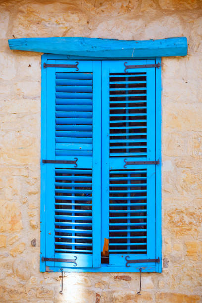 istock Blue old wooden window shutters. 904590536