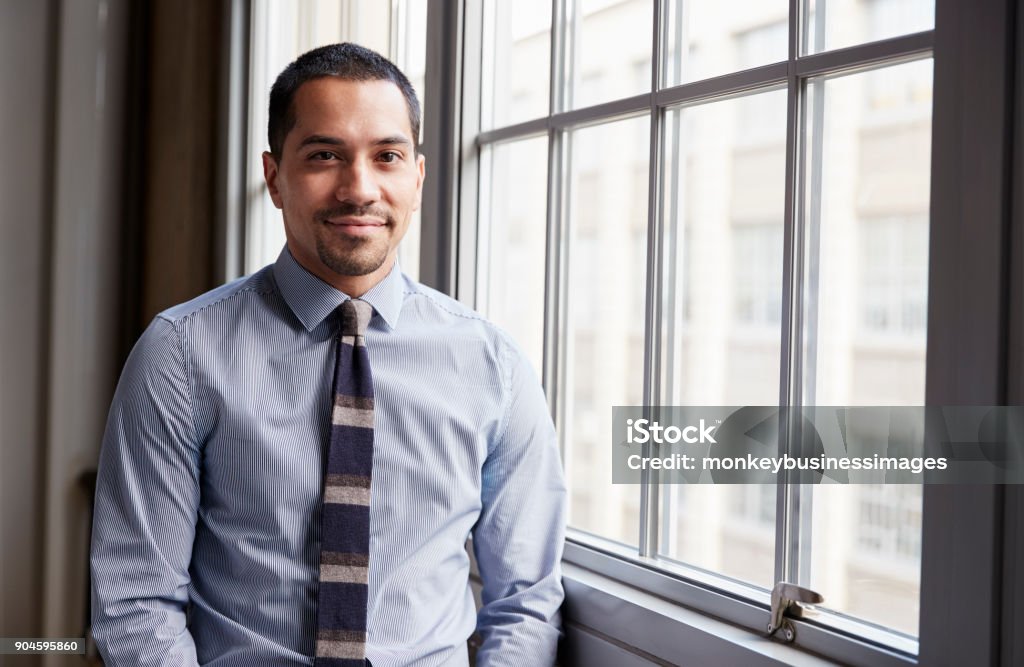 Young Hispanic business man smiling to camera Latin American and Hispanic Ethnicity Stock Photo