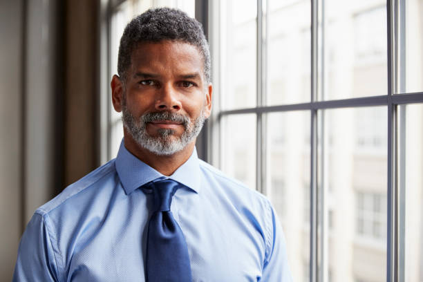 istock Middle aged black businessman looking to camera 904595986