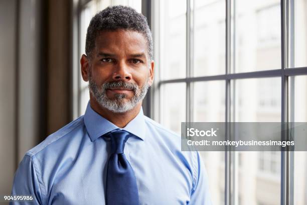 Middle Aged Black Businessman Looking To Camera Stock Photo - Download Image Now - Serious, Men, Businessman